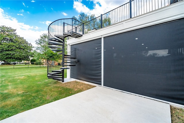 view of home's exterior featuring a lawn and a patio