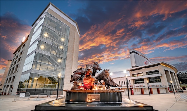 view of outdoor building at dusk