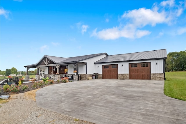 view of front of home with a garage and a porch