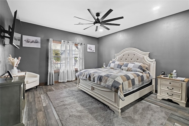 bedroom featuring dark wood-type flooring and ceiling fan