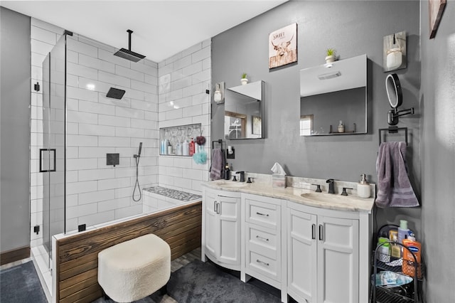 bathroom with vanity and a shower with shower door