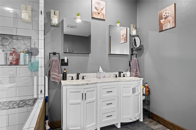 bathroom featuring vanity and wood-type flooring