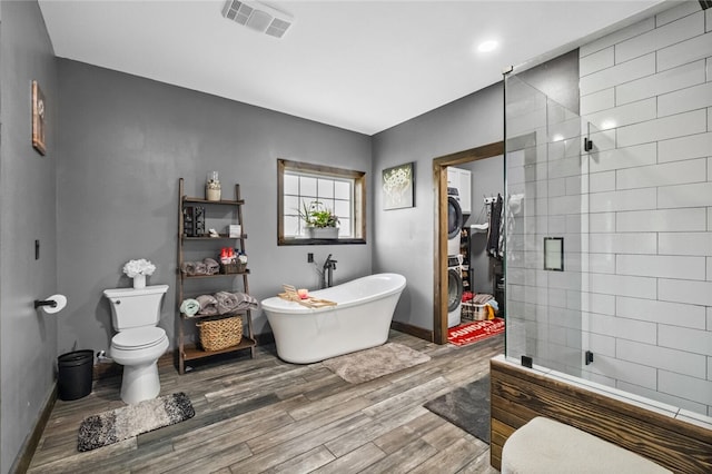 bathroom with separate shower and tub, wood-type flooring, and toilet