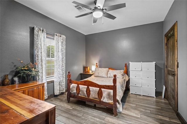 bedroom featuring ceiling fan and hardwood / wood-style floors