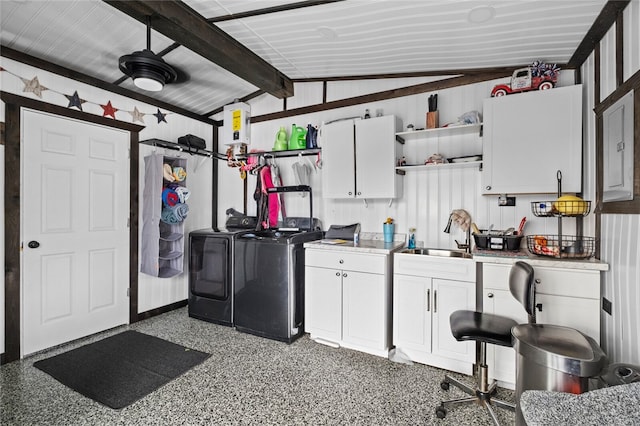 garage with washing machine and clothes dryer and sink