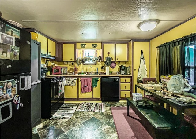 kitchen with under cabinet range hood, black appliances, and a sink