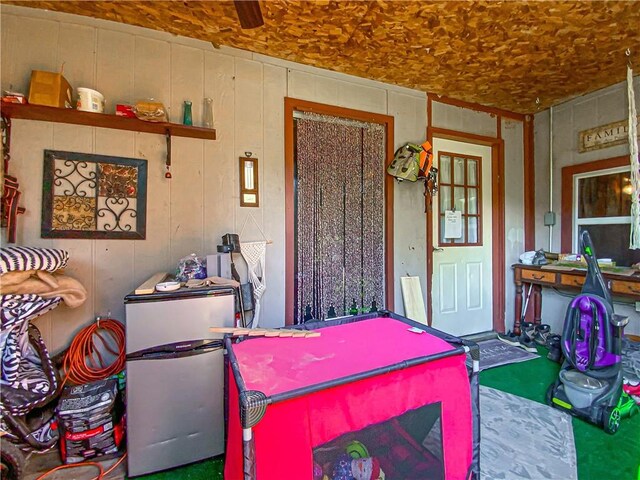 interior space featuring wooden walls