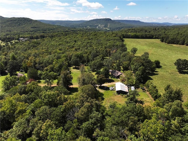 aerial view featuring a mountain view and a wooded view