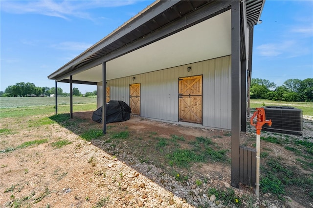 exterior space featuring central AC unit