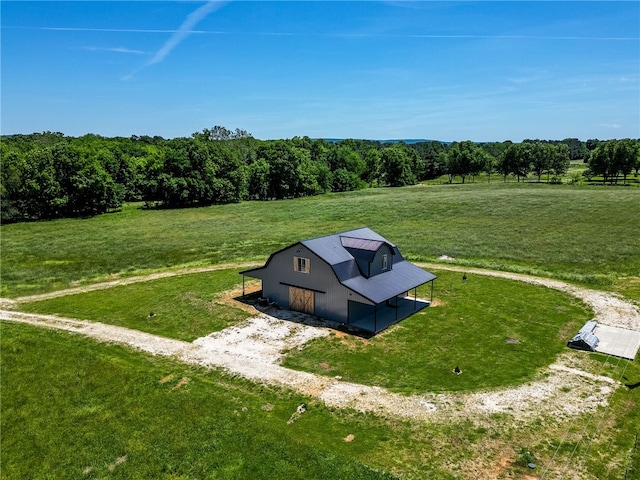 birds eye view of property with a rural view