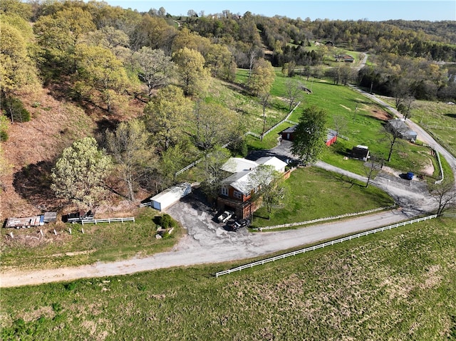 birds eye view of property with a rural view