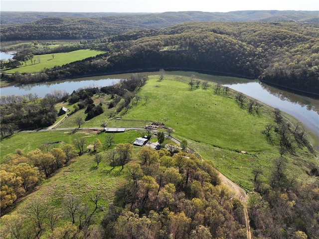 drone / aerial view with a rural view and a water view