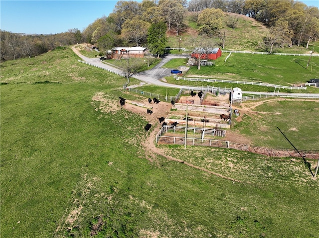 birds eye view of property with a rural view