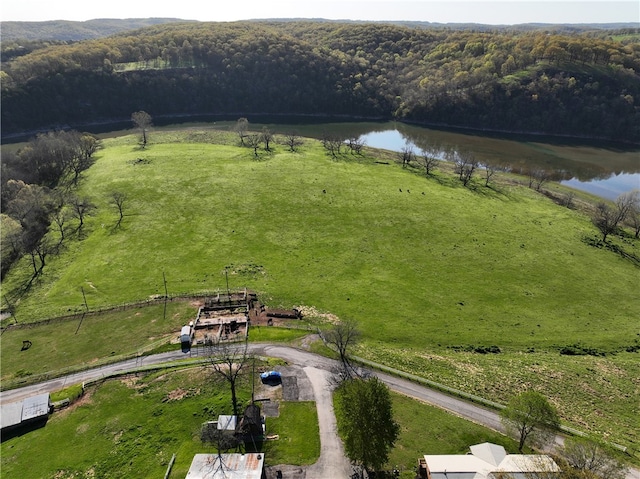 birds eye view of property featuring a water view and a rural view