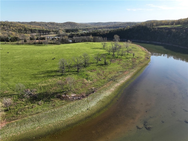 drone / aerial view with a water view and a rural view