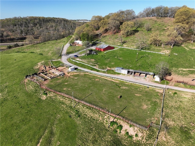 birds eye view of property with a rural view