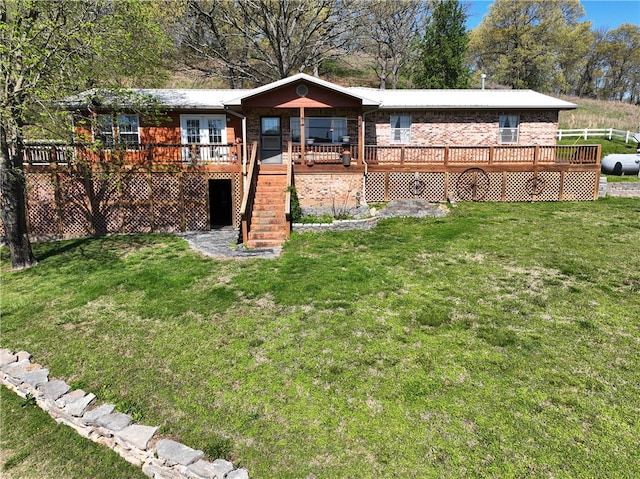 exterior space with a wooden deck and a yard