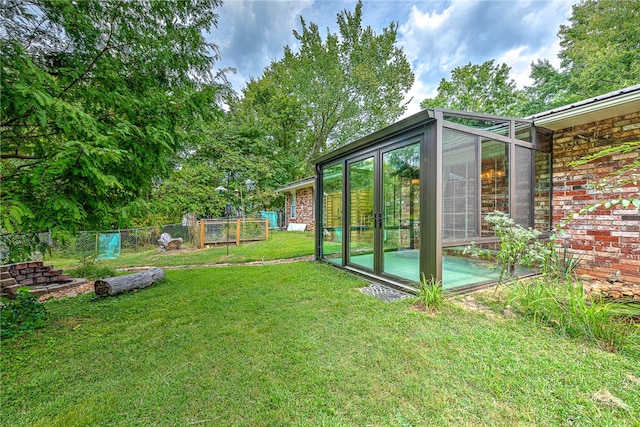 view of yard with a sunroom