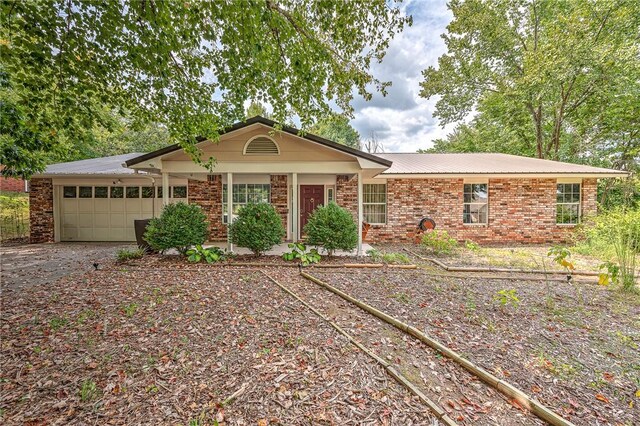 single story home featuring a garage