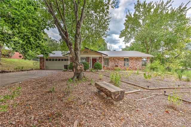 ranch-style house featuring a garage