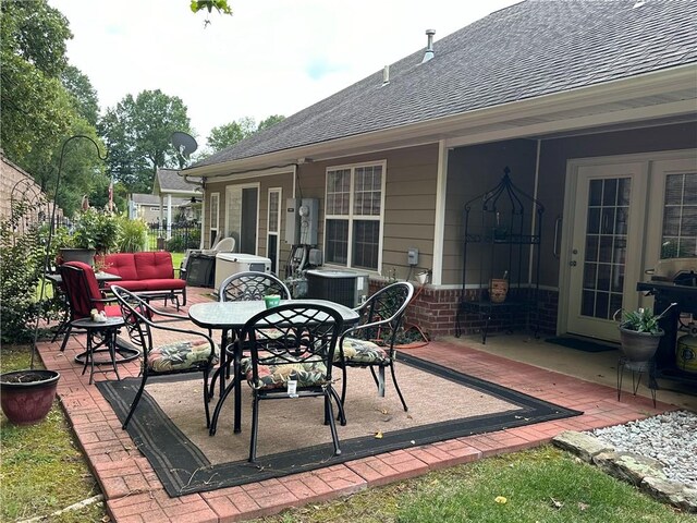 view of patio / terrace featuring french doors and central air condition unit