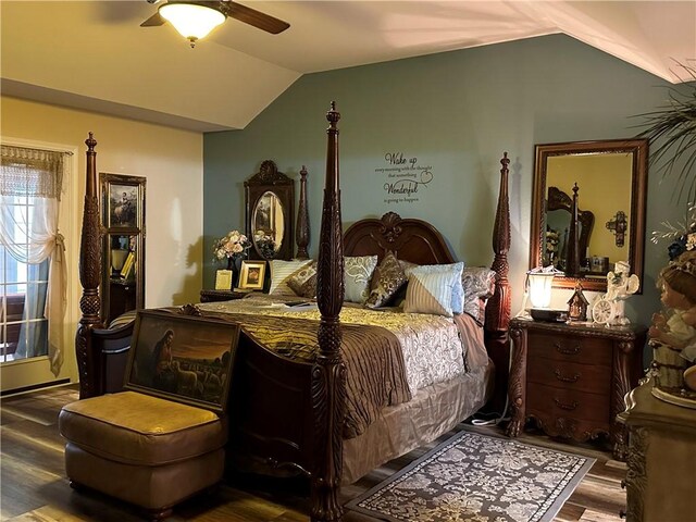 bedroom featuring wood-type flooring, vaulted ceiling, and ceiling fan