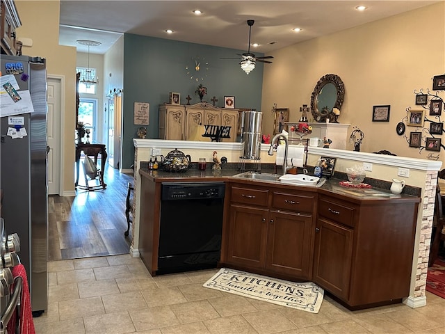 kitchen featuring stainless steel refrigerator, decorative light fixtures, dishwasher, ceiling fan, and light hardwood / wood-style floors