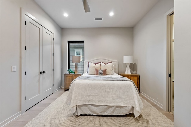 bedroom featuring ceiling fan and light hardwood / wood-style flooring