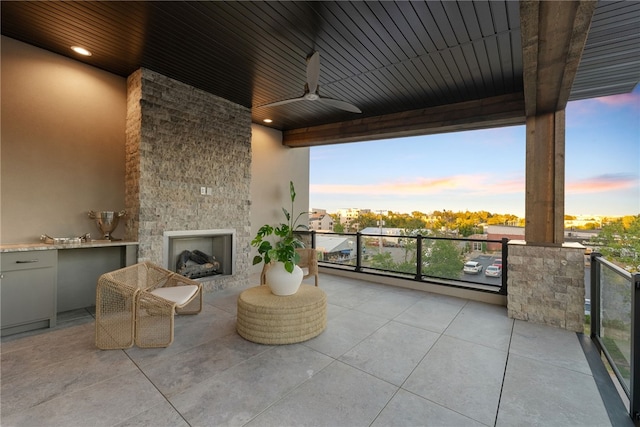 exterior space featuring an outdoor stone fireplace