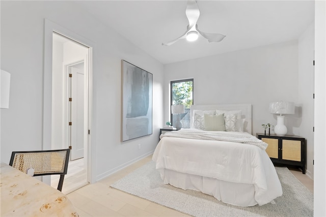 bedroom with ceiling fan and wood-type flooring