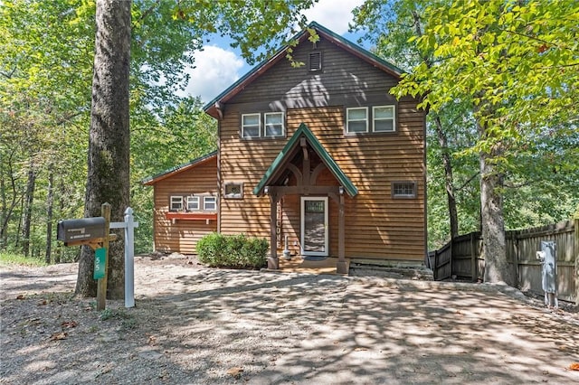 rustic home with fence