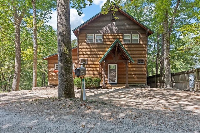 view of front of property featuring fence