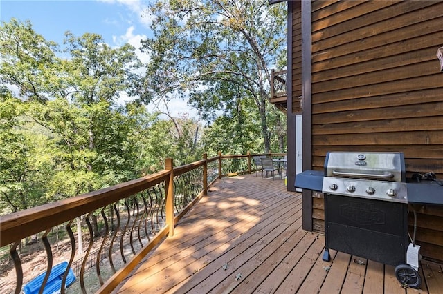 wooden terrace with area for grilling