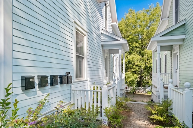 view of property exterior featuring a porch