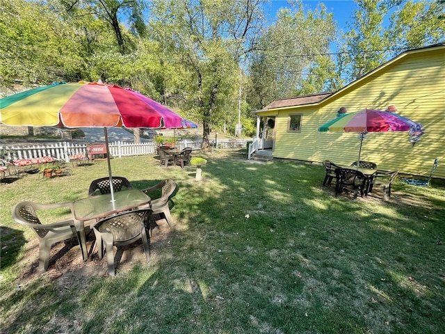 view of yard featuring an outdoor fire pit