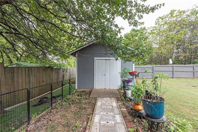 view of outbuilding featuring a yard