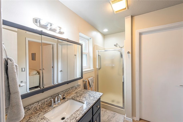 bathroom with vanity and an enclosed shower