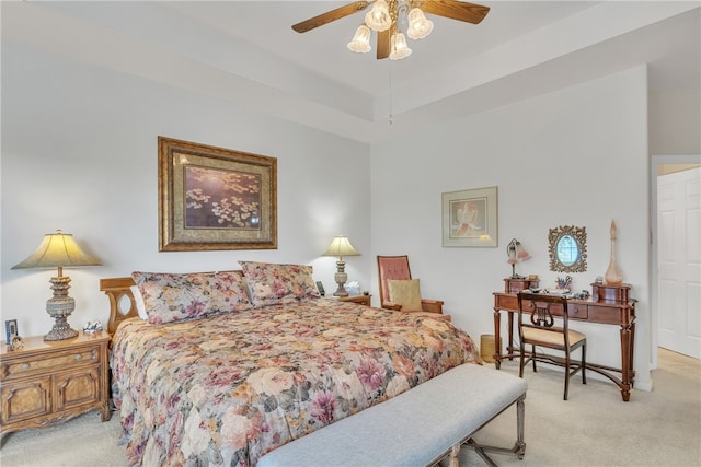 bedroom featuring light carpet and ceiling fan