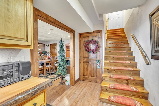 stairway featuring wood-type flooring