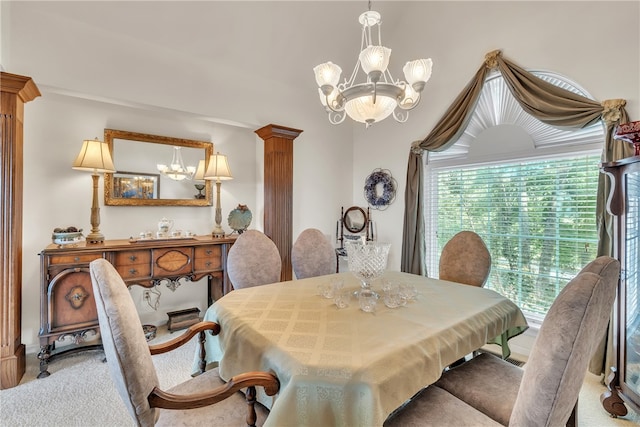 carpeted dining space with an inviting chandelier