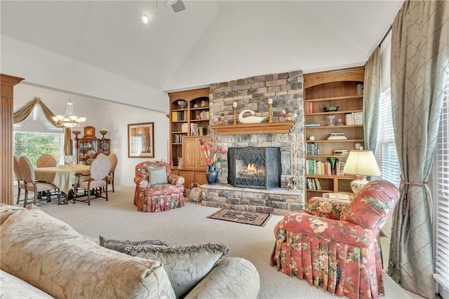 living room featuring carpet, built in features, a fireplace, and lofted ceiling