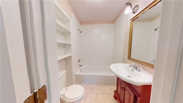 full bathroom with toilet, tiled shower / bath, tile patterned flooring, vanity, and built in features