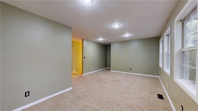 11566 Hickory Dr, Garfield, AR 72732 - spare room featuring light colored carpet, recessed lighting, and baseboards