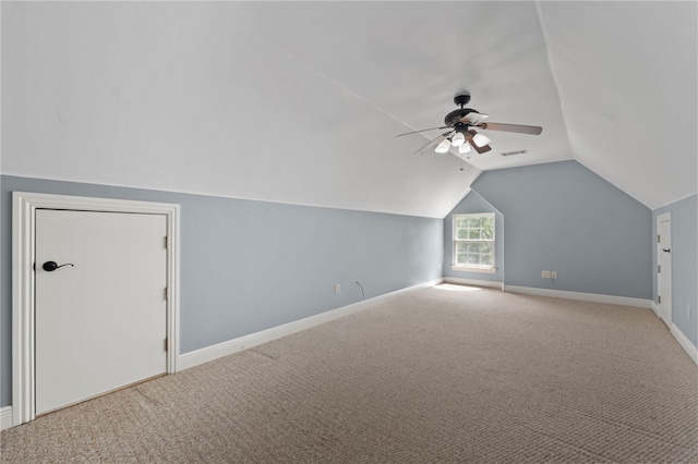 additional living space with light carpet, lofted ceiling, and ceiling fan