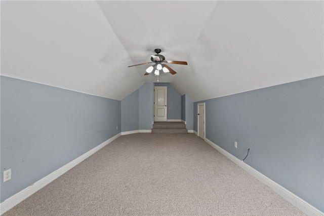 bonus room featuring vaulted ceiling, carpet floors, and ceiling fan