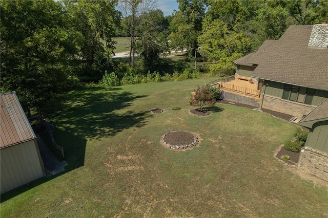 view of yard with a fire pit