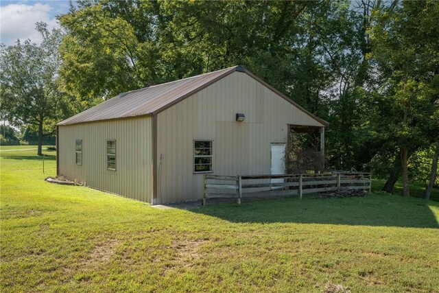 view of outdoor structure with a lawn