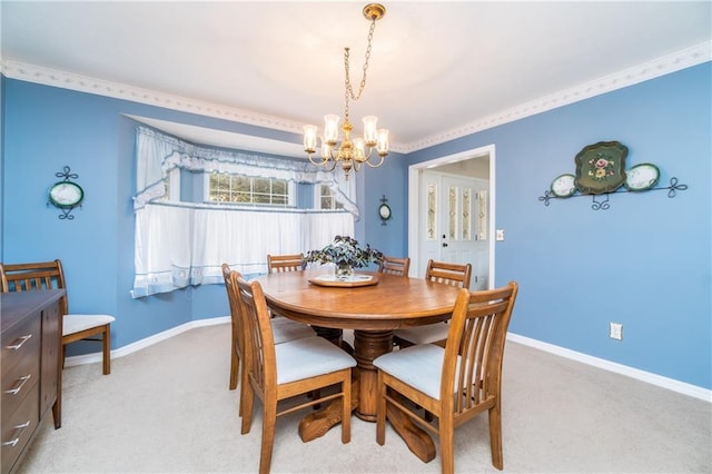 carpeted dining space with a chandelier