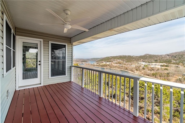 wooden deck featuring ceiling fan