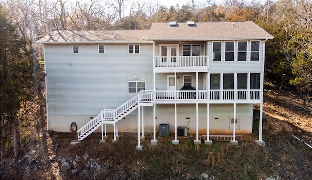 back of house featuring a balcony and central air condition unit